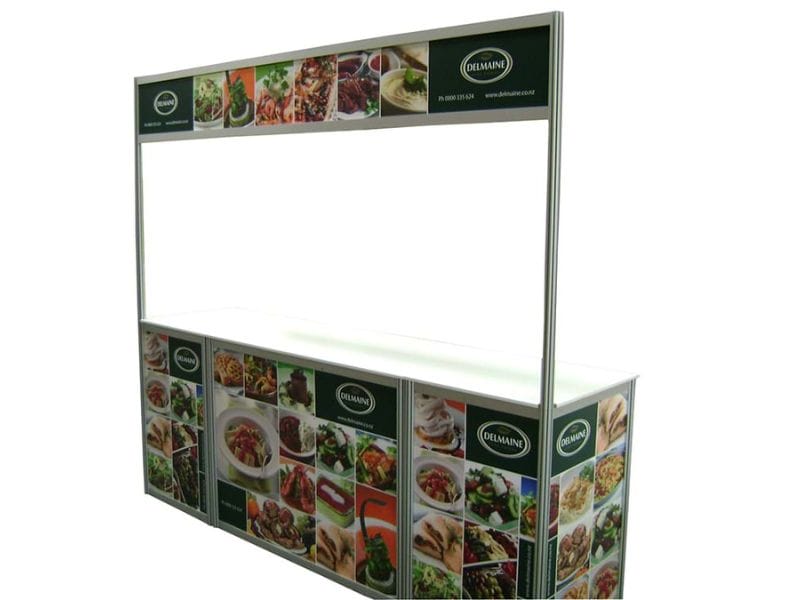 Brandframe sales table for Delmaine used at a food exhibition - Displays2Go