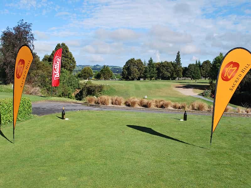 Teardrop 2 Go flags at a corporate golf day (with ground spikes). - Displays2Go