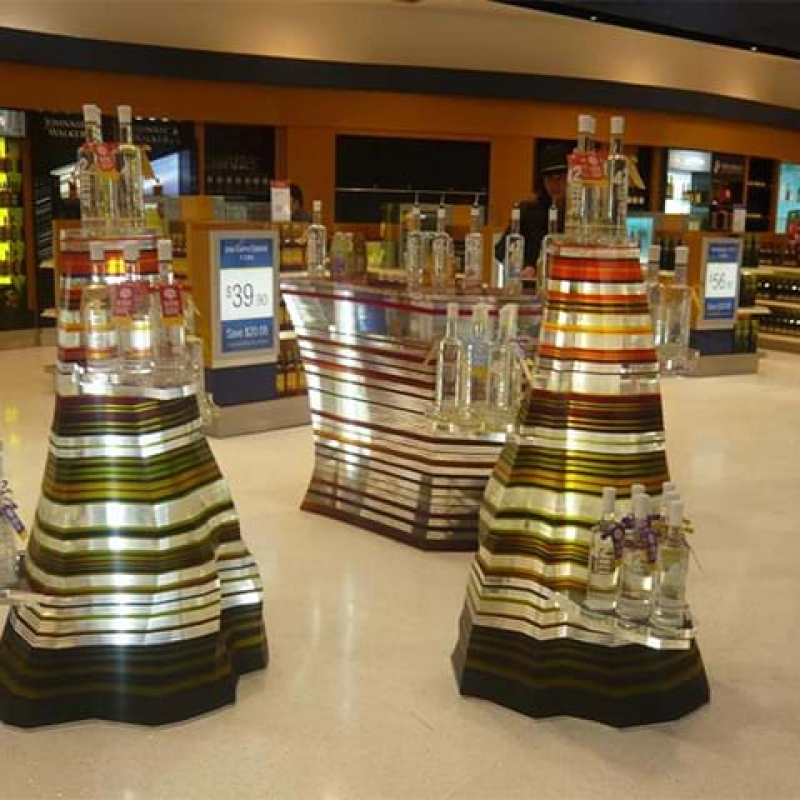 Layered acrylic stands for airport duty free store - stunning! - Displays2Go.com.au