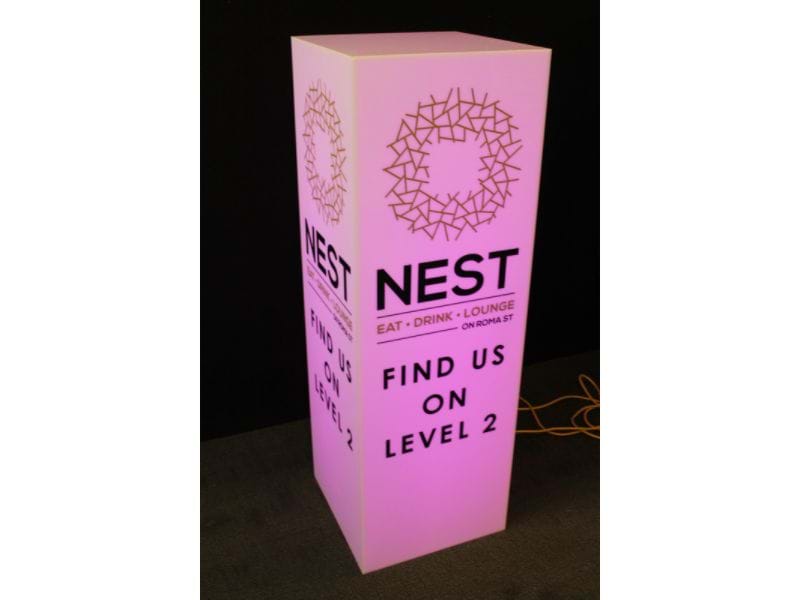 A frosted plinth with opaque cut vinyl lettering